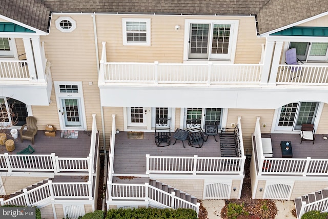 rear view of property with a wooden deck