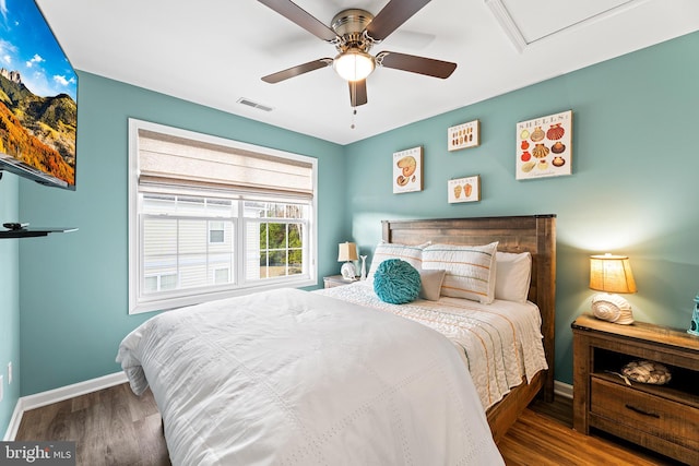 bedroom with hardwood / wood-style floors and ceiling fan