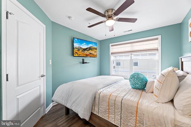 bedroom featuring ceiling fan and dark hardwood / wood-style flooring