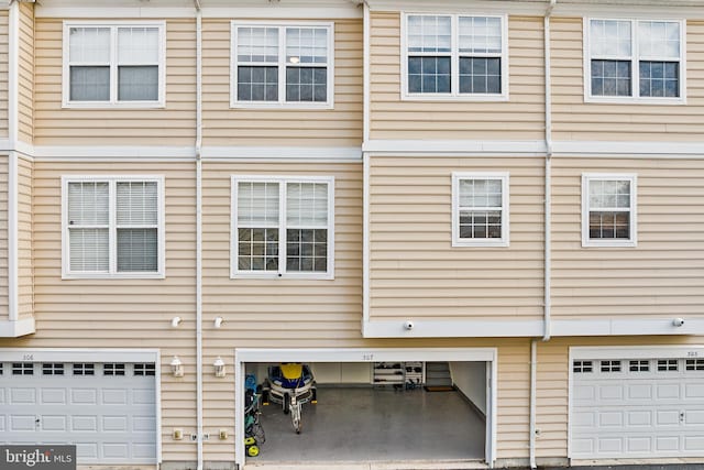 view of side of property with a garage