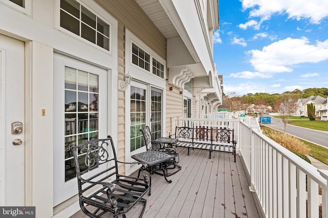 wooden terrace with a porch