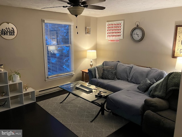 living room featuring a textured ceiling, ceiling fan, baseboard heating, and hardwood / wood-style flooring