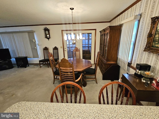 dining space featuring crown molding, light carpet, and an inviting chandelier