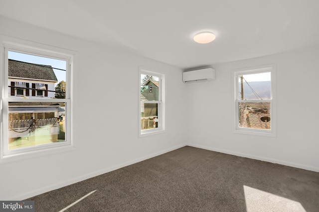 empty room featuring dark colored carpet and a wall mounted AC