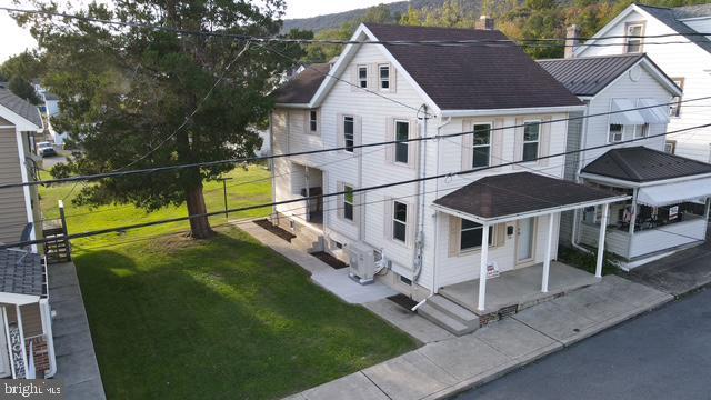 view of side of home featuring a yard