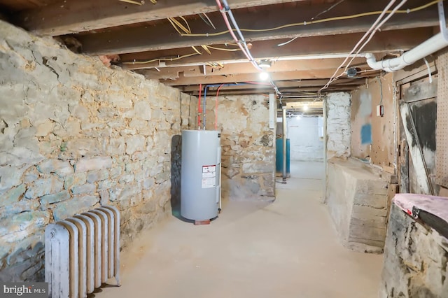 basement with radiator and electric water heater