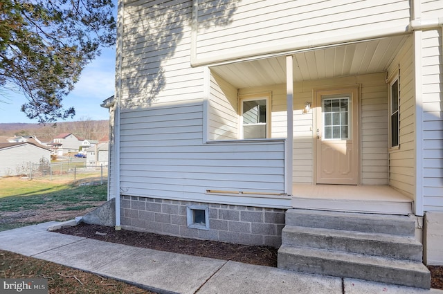 doorway to property featuring a porch