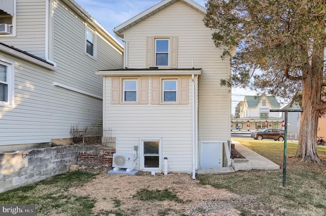 back of property featuring ac unit