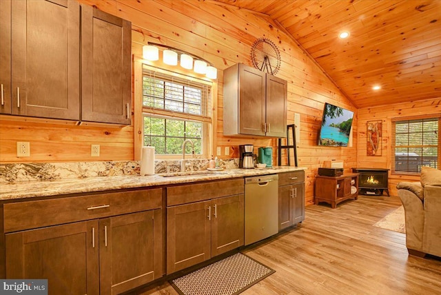 kitchen with dishwashing machine, wooden walls, sink, wooden ceiling, and light hardwood / wood-style floors