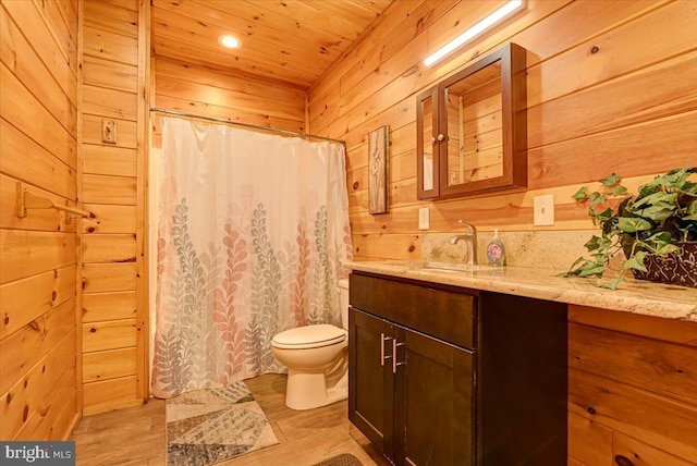 bathroom featuring wood-type flooring, toilet, wooden walls, vanity, and wood ceiling