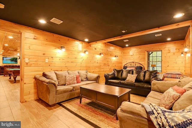 cinema featuring wood walls, pool table, and light wood-type flooring