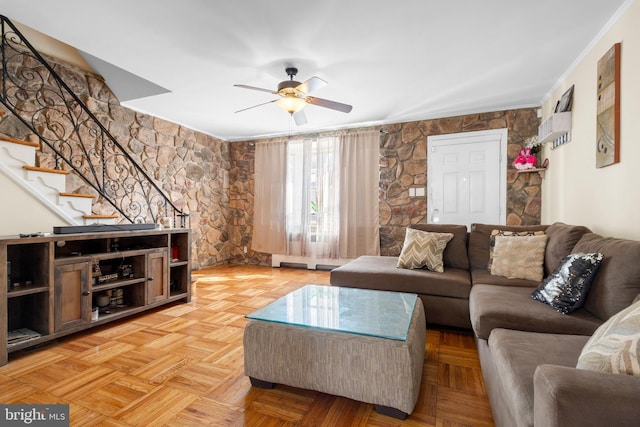 living room with ceiling fan and light parquet floors