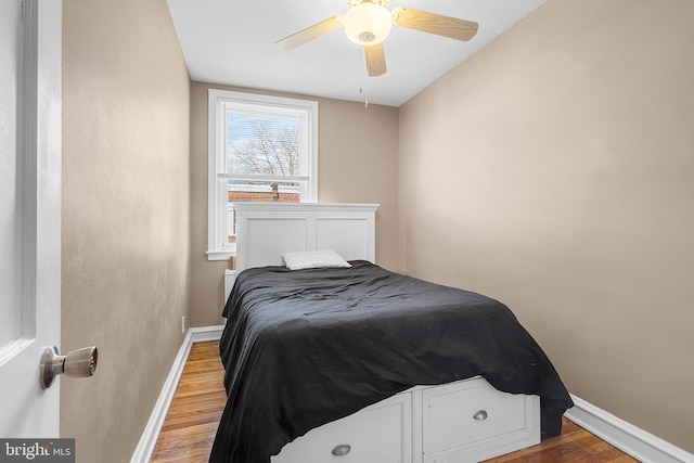 bedroom featuring ceiling fan and hardwood / wood-style floors