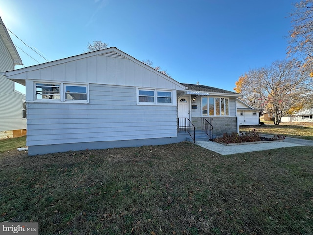 view of front of home with a front yard