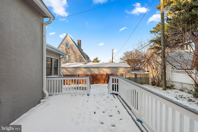 view of snow covered deck