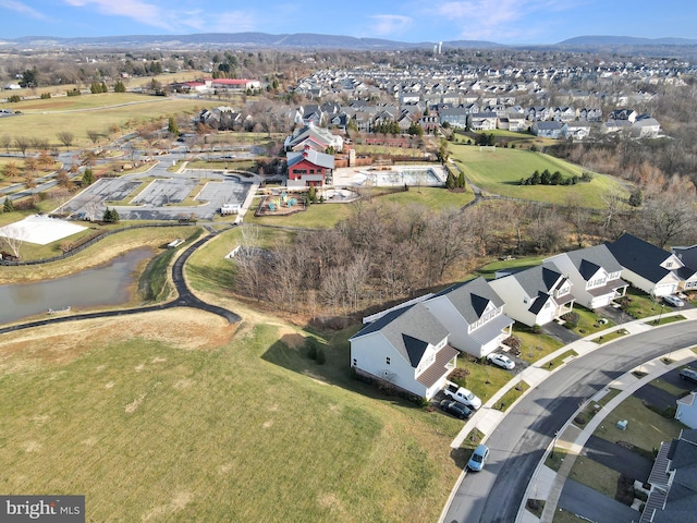 bird's eye view with a water and mountain view