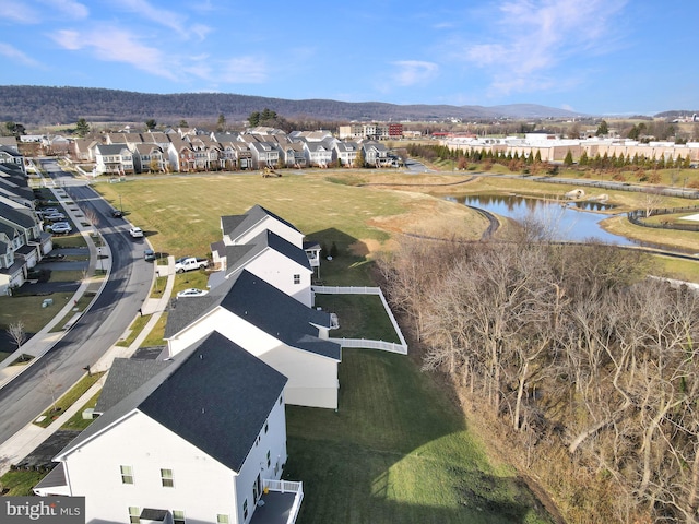 aerial view featuring a water and mountain view