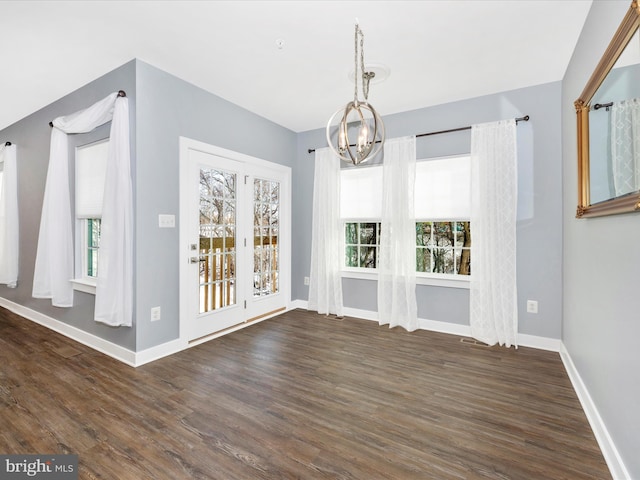 unfurnished dining area with dark hardwood / wood-style floors