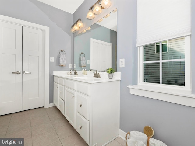 bathroom with tile patterned flooring and vanity