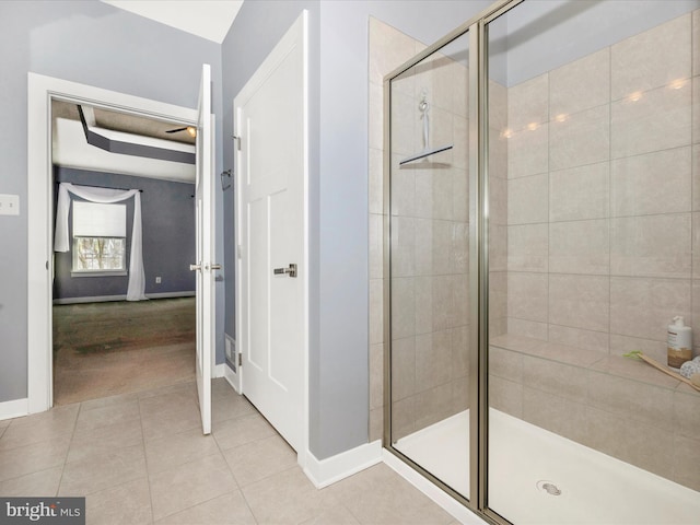 bathroom featuring tile patterned flooring and an enclosed shower