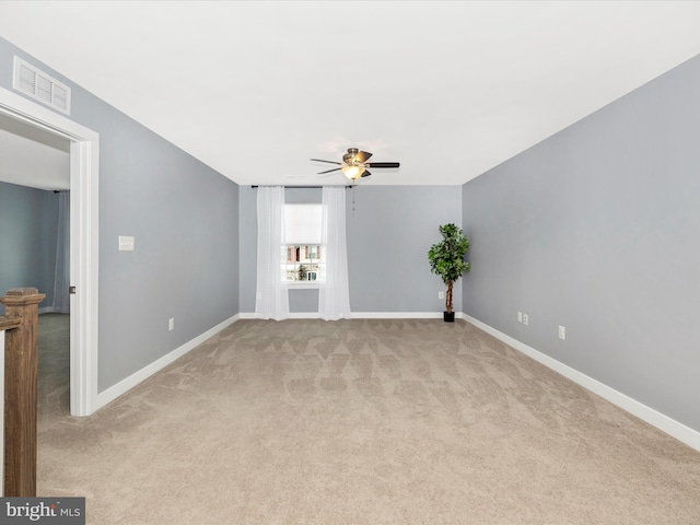 carpeted empty room with ceiling fan