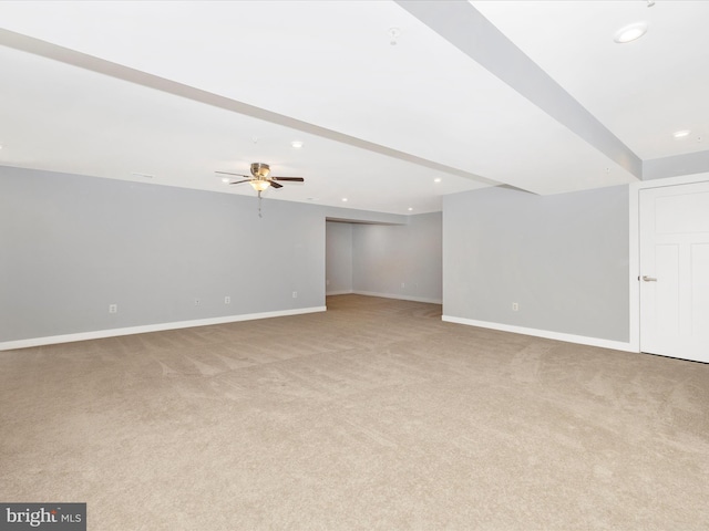 interior space featuring light carpet and ceiling fan