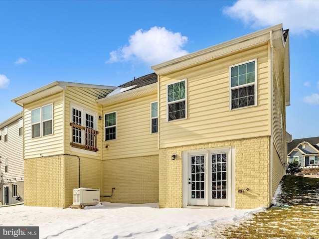 view of snow covered house