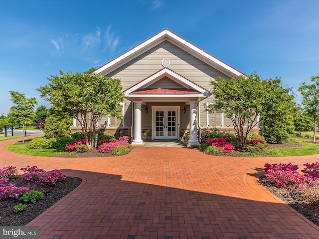 property entrance featuring french doors