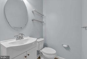 bathroom with vanity and toilet