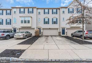 multi unit property featuring a garage