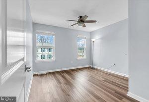 empty room featuring hardwood / wood-style floors and ceiling fan