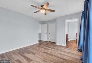 unfurnished bedroom featuring ceiling fan and light hardwood / wood-style floors