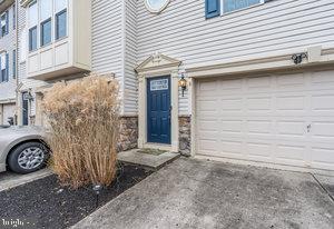 view of exterior entry featuring a garage