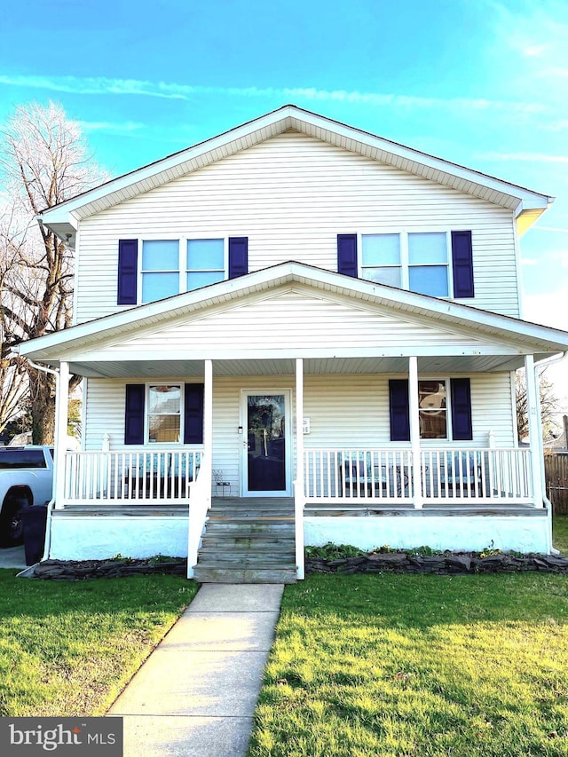 view of front of home with a front lawn and covered porch