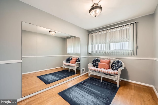 sitting room with hardwood / wood-style floors