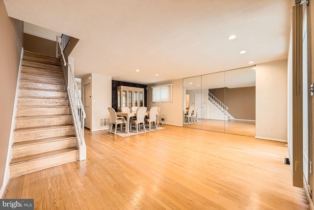 interior space featuring hardwood / wood-style floors and a textured ceiling