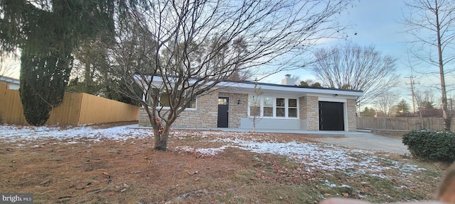 single story home with a garage