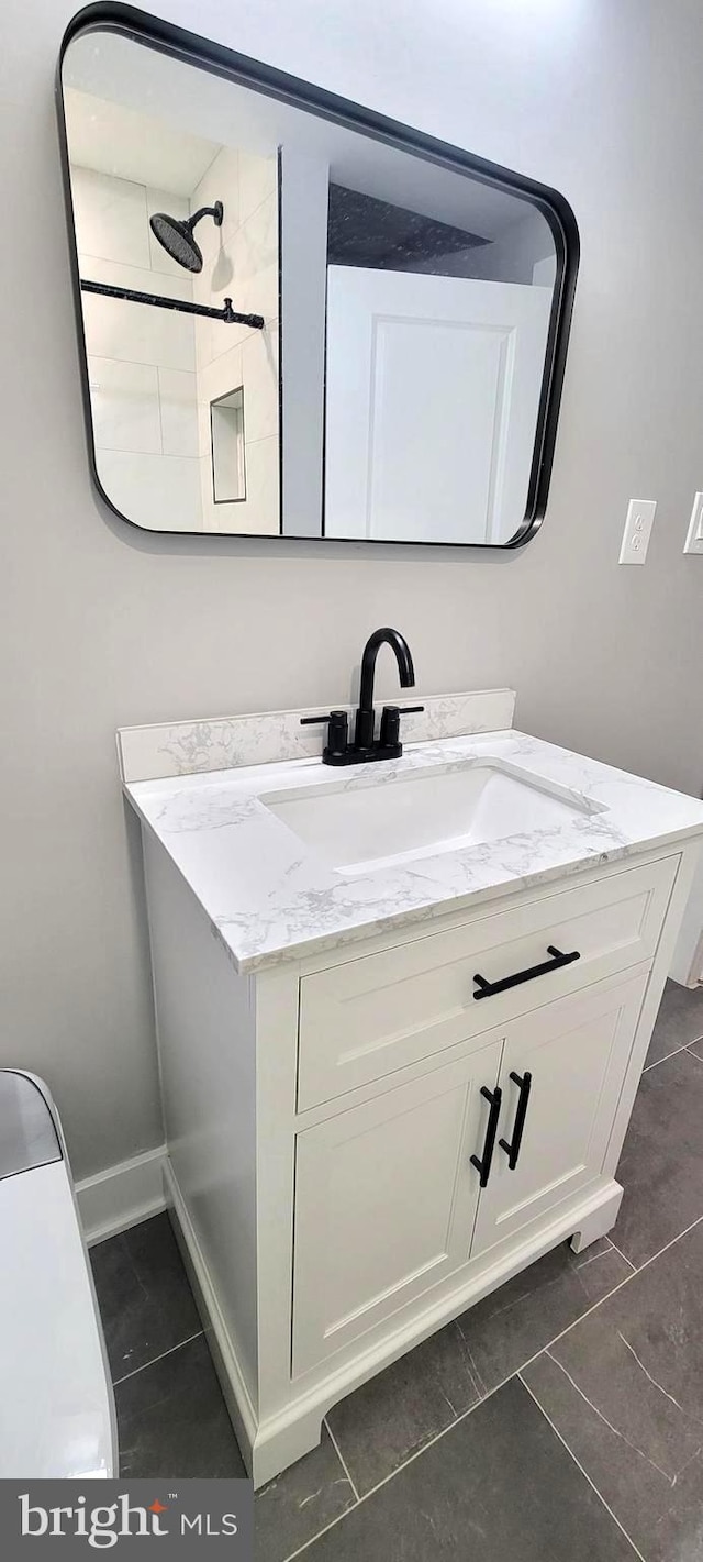 bathroom featuring tile patterned floors and vanity