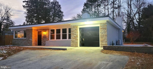 ranch-style house featuring a garage