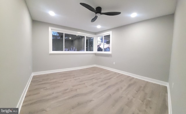 unfurnished room with light wood-type flooring and ceiling fan