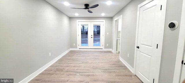 entryway featuring ceiling fan, light hardwood / wood-style flooring, and french doors