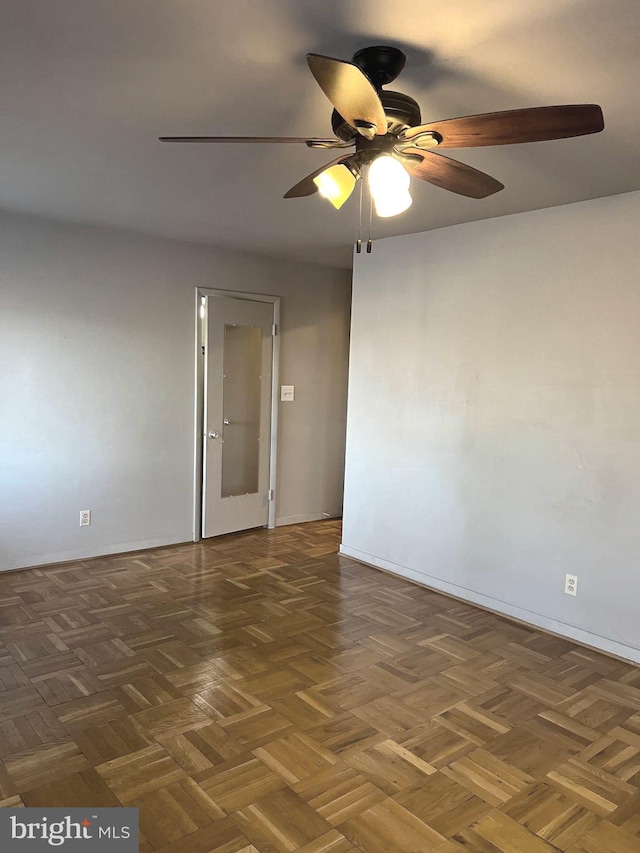 empty room with dark parquet floors