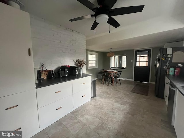 kitchen with ceiling fan, dishwasher, and white cabinetry