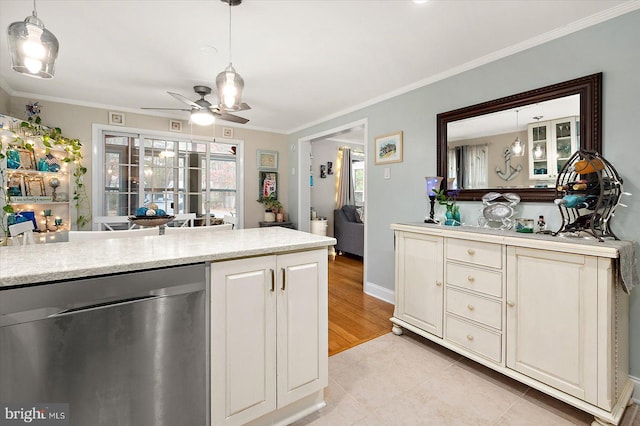 kitchen with light wood-type flooring, stainless steel dishwasher, ornamental molding, ceiling fan, and decorative light fixtures