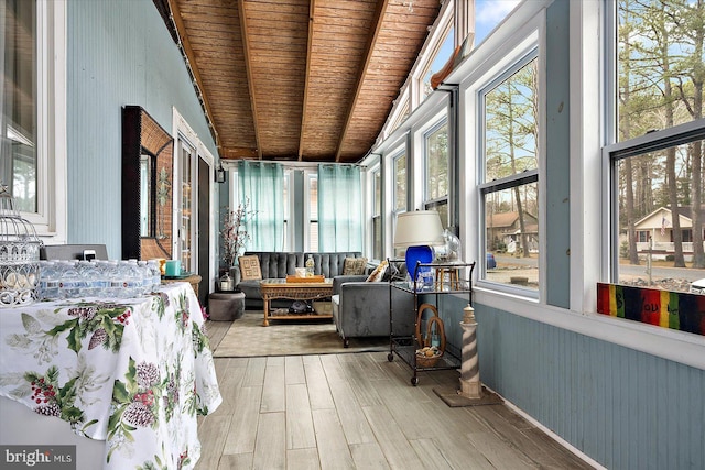 sunroom with beam ceiling and wood ceiling