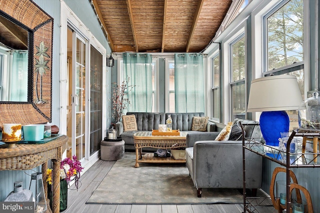 sunroom / solarium featuring lofted ceiling with beams, plenty of natural light, and wooden ceiling