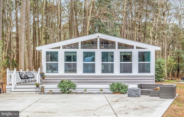 view of outdoor structure featuring an outdoor hangout area