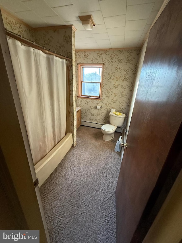 bathroom featuring walk in shower, a baseboard heating unit, and toilet