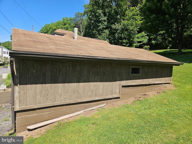 view of property exterior with a yard