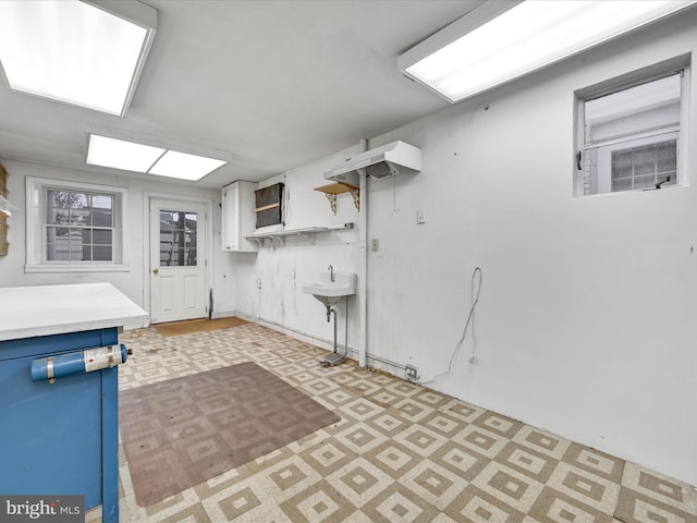 kitchen with white cabinets and blue cabinetry